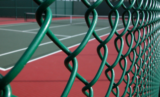 This is a photo of a new tennis court fence installed in Dorset, All works carried out by Tennis Court Construction Dorset