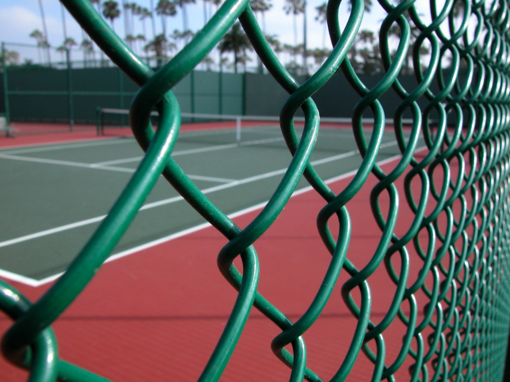 This is a photo of a new tennis court fence installed in Dorset, All works carried out by Tennis Court Construction Dorset